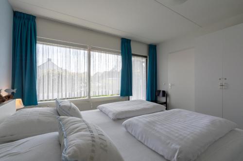 Postel nebo postele na pokoji v ubytování Beach Appartement 11 Callantsoog