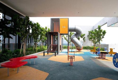a playground with a slide in a building at #12Georgetown Luxury Suite with Rooftop Pool in George Town