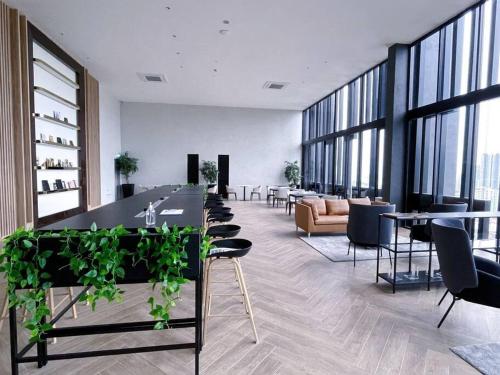 a large room with tables and chairs in a building at #12Georgetown Luxury Suite with Rooftop Pool in George Town
