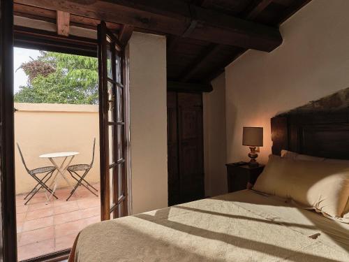 Säng eller sängar i ett rum på Agriturismo Castello Santa Margherita