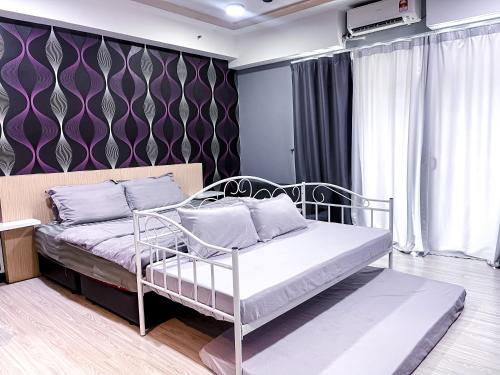 Katil atau katil-katil dalam bilik di Nizar Apartment D’Perdana