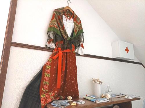 a dress hanging on a shelf in a room at Apartmani Daniela in Rab