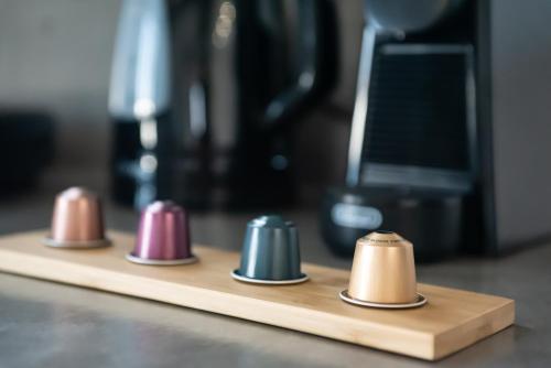 a row of different colored knobs sitting on a counter at Passa Corda Suites with amazing view in Galanado
