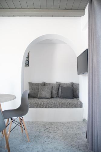 a living room with a couch and a table at Passa Corda Suites with amazing view in Galanado