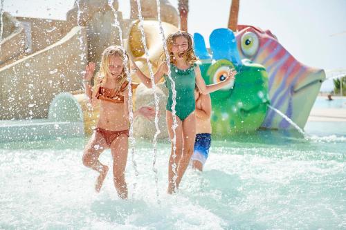 two young girls playing in a water park at Iberostar Cala Domingos All Inclusive in Calas de Mallorca