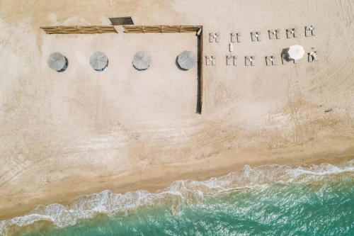 an aerial view of the beach and the ocean at Relaxing villa with access to pool and beach in Ras al Khaimah