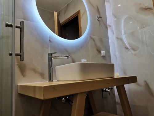 a bathroom with a sink and a mirror at Nely's Luxury Home in Nydri