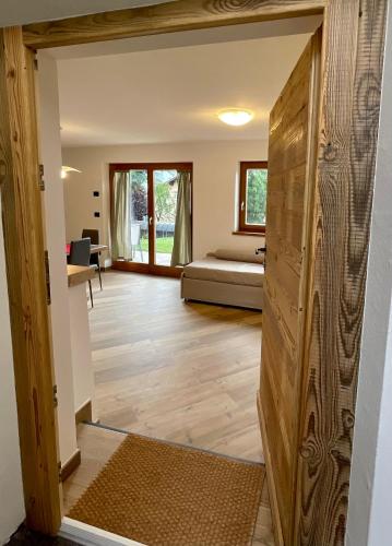 a room with a door leading into a bedroom at Casa Fabiolin in Daiano