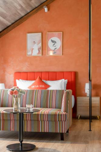 a living room with a couch and a table at De La Sol Villa Dalat in Da Lat