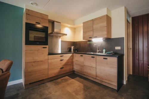 Η κουζίνα ή μικρή κουζίνα στο Appartement met bedstee