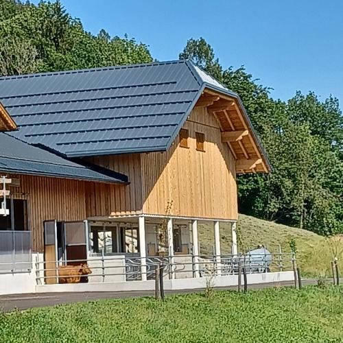 a barn with a metal roof on top of it at Auerhiasbauer in St. Wolfgang