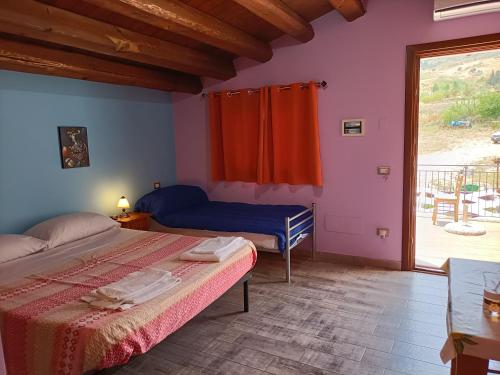 A bed or beds in a room at Casolare La Torre