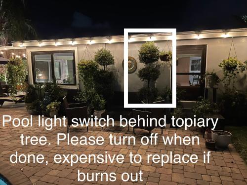 a picture of a house at night at Private Heated Pool Oasis Pet-Friendly Retreat Short or long Stays Sleeps 2-8 Ppl in Pompano Beach