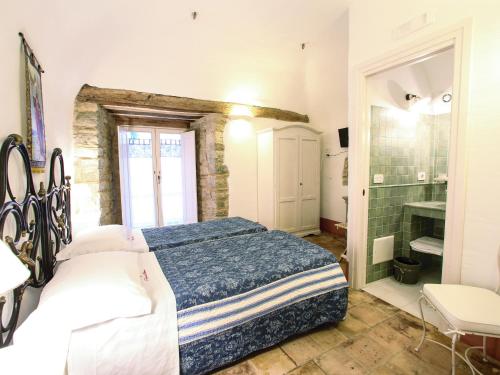En eller flere senge i et værelse på I Templari di Alberona