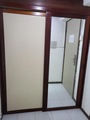 a pair of glass doors in a room at Lindo Flat no Royal Residence Flat in João Pessoa