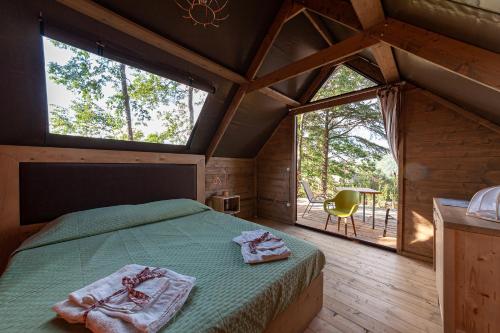 A bed or beds in a room at AgriResort Spa Glamping Poggio Di Montedoro