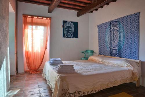 Ένα ή περισσότερα κρεβάτια σε δωμάτιο στο Camera a Casa Castora
