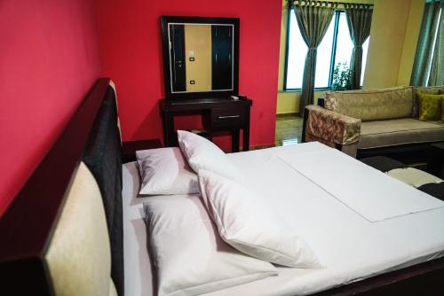 Ein Bett oder Betten in einem Zimmer der Unterkunft Hotel Magic