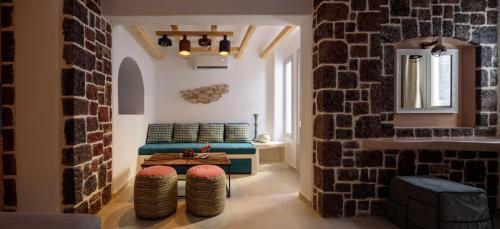a living room with a couch and a table at Acro Blue Luxury Villas in Akrotiri