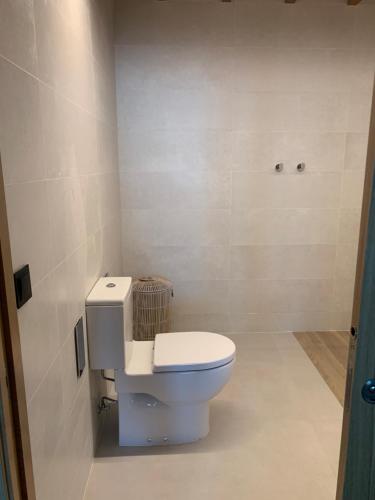 a bathroom with a toilet in a room at Mar De Muros in Muros