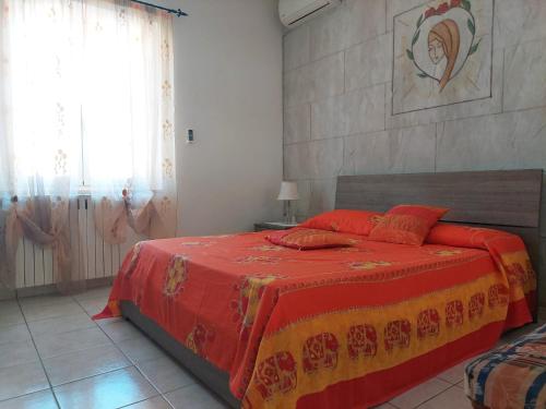 Postel nebo postele na pokoji v ubytování Casa Vacanze La Piazzz