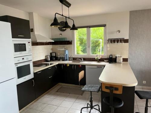 Kuchyň nebo kuchyňský kout v ubytování Maison Le Coteau Plage vue mer, 8 pers. Petit Caux