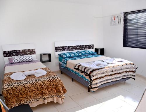 En eller flere senge i et værelse på Apartamentos Terras Altas
