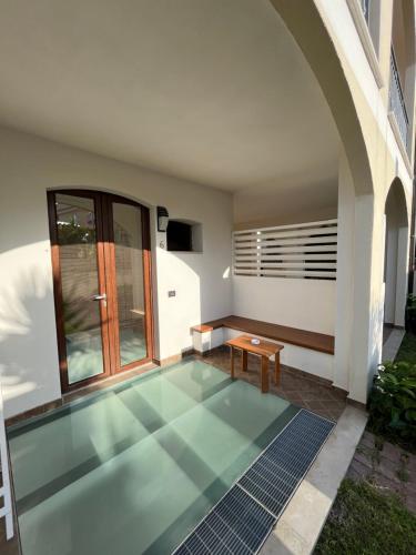 a house with a tile floor in a courtyard at Residenza Azzurra in Tropea