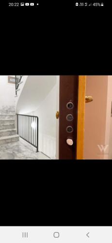 a picture of a stairway with a door and stairs at Dimora Italia in Campobasso