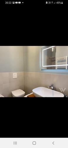 a bathroom with a white sink and a toilet at Dimora Italia in Campobasso