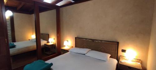 Ein Bett oder Betten in einem Zimmer der Unterkunft Le Ville del Mediterraneo