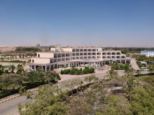 an aerial view of a large white building at Assiut Cement Hotel in Asyut