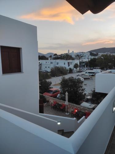 a balcony with a view of a parking lot at Vythos in Adamas