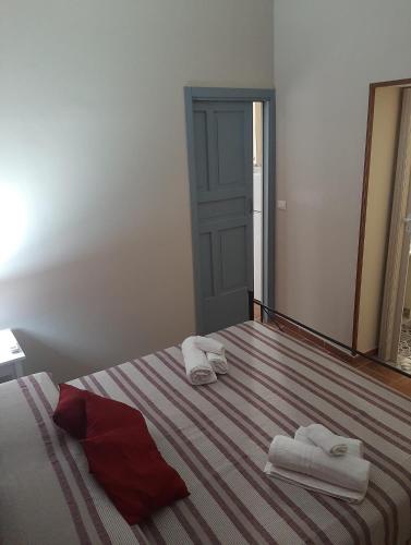 Posteľ alebo postele v izbe v ubytovaní CASA VACANZA DI VIA GIACALONE