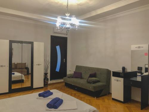a living room with a couch and a mirror at Philia's Guest House in Sighnaghi