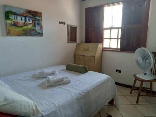 En eller flere senge i et værelse på Casa espaçosa a 15 min. a pé do Centro Histórico