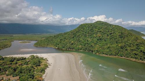 an aerial view of a river and a mountain at Pousada Y-Goá in Bertioga