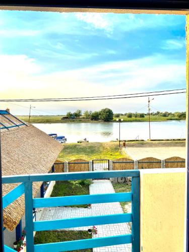 a view of a body of water from a balcony at Casa Munteanu in Mila Douăzeci şi Trei