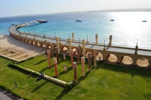 a bridge over the water next to a body of water at Sahl Hasheesh, El Andalous by All View apartements in Hurghada