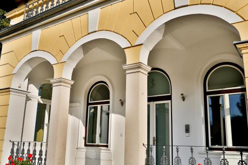 a facade of a building with arches at Villa Aurelie in Velké Losiny
