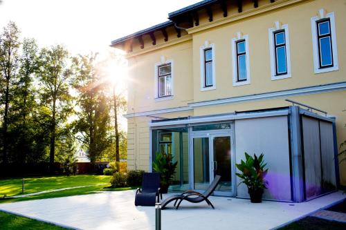 a house with a bench in front of it at Villa Aurelie in Velké Losiny