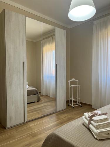 A bed or beds in a room at Casa vacanze l’orchidea