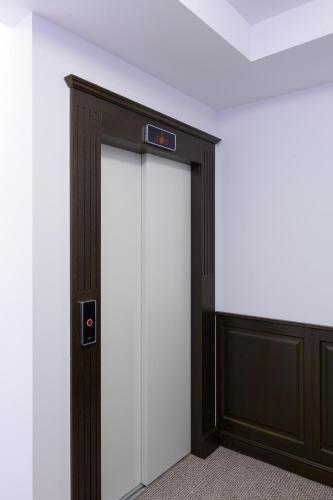 an elevator door in an office building at Piatra Pinului Ski & Spa in Gura Humorului