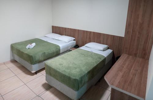 Ein Bett oder Betten in einem Zimmer der Unterkunft Hotel Zandoná
