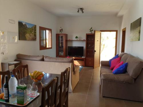 a living room with a couch and a table at Casa Gerian in Vallehermoso