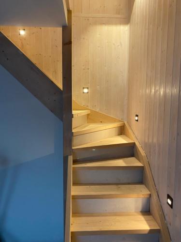 a sauna with wooden stairs in a room at SERW in Władysławowo