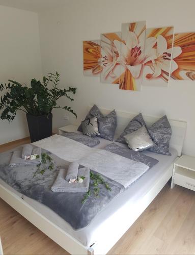 a bed with two pillows on it in a room at Ferienwohnung Andrejcic in Feistritz im Rosental