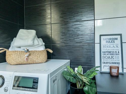 a microwave oven with a basket on top of it at The Novac's Cottage in Råneå