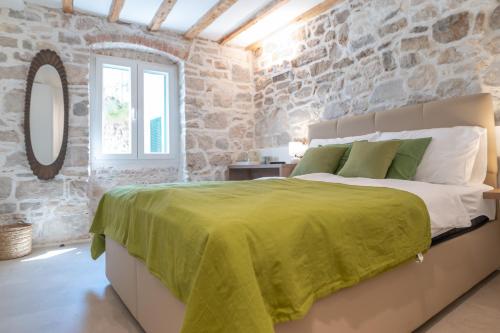 Posteľ alebo postele v izbe v ubytovaní Vitelli Apartments and Rooms