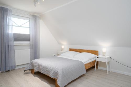 מיטה או מיטות בחדר ב-Haus Sommerzeit